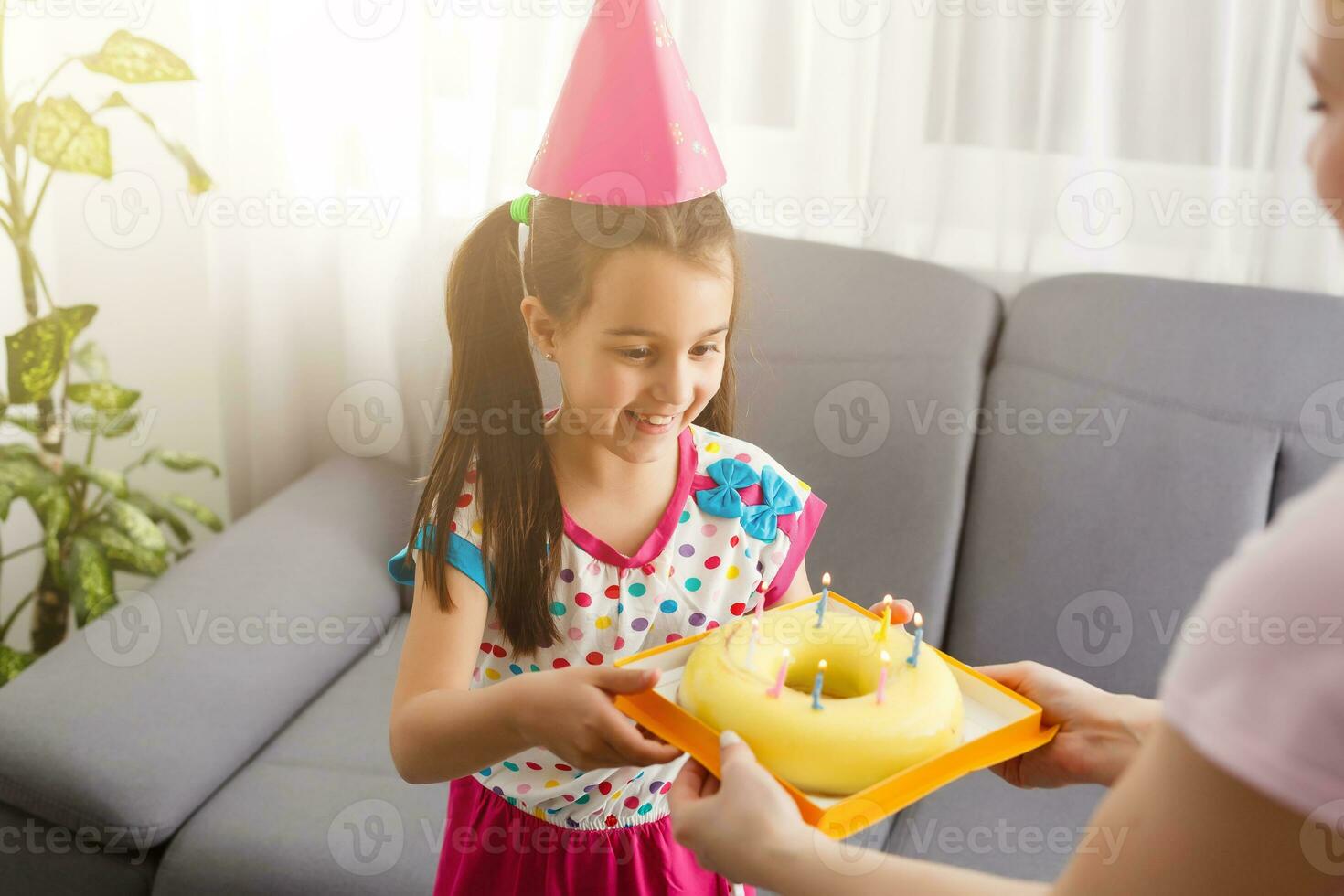 Happy girl sibling celebrating birthday via internet in quarantine time, self-isolation and family values, online birthday party. Congratulations animator via laptop, online. Stay at home photo