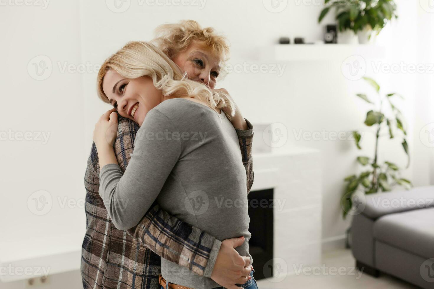 happy senior mother and adult daughter closeup portrait at home photo