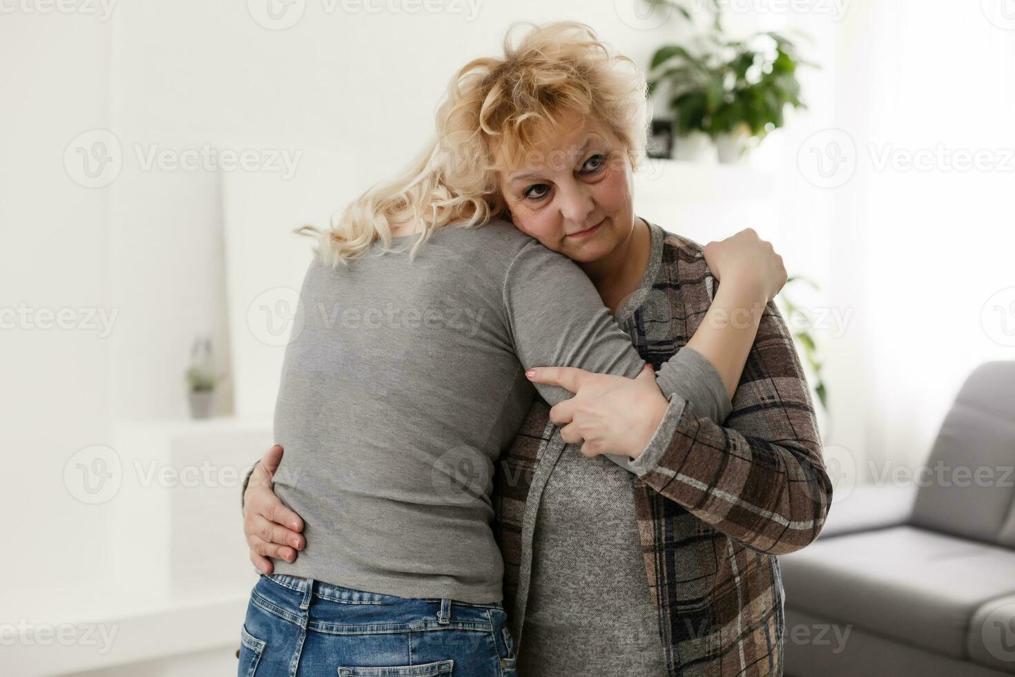 pretty woman and senior mother at home photo