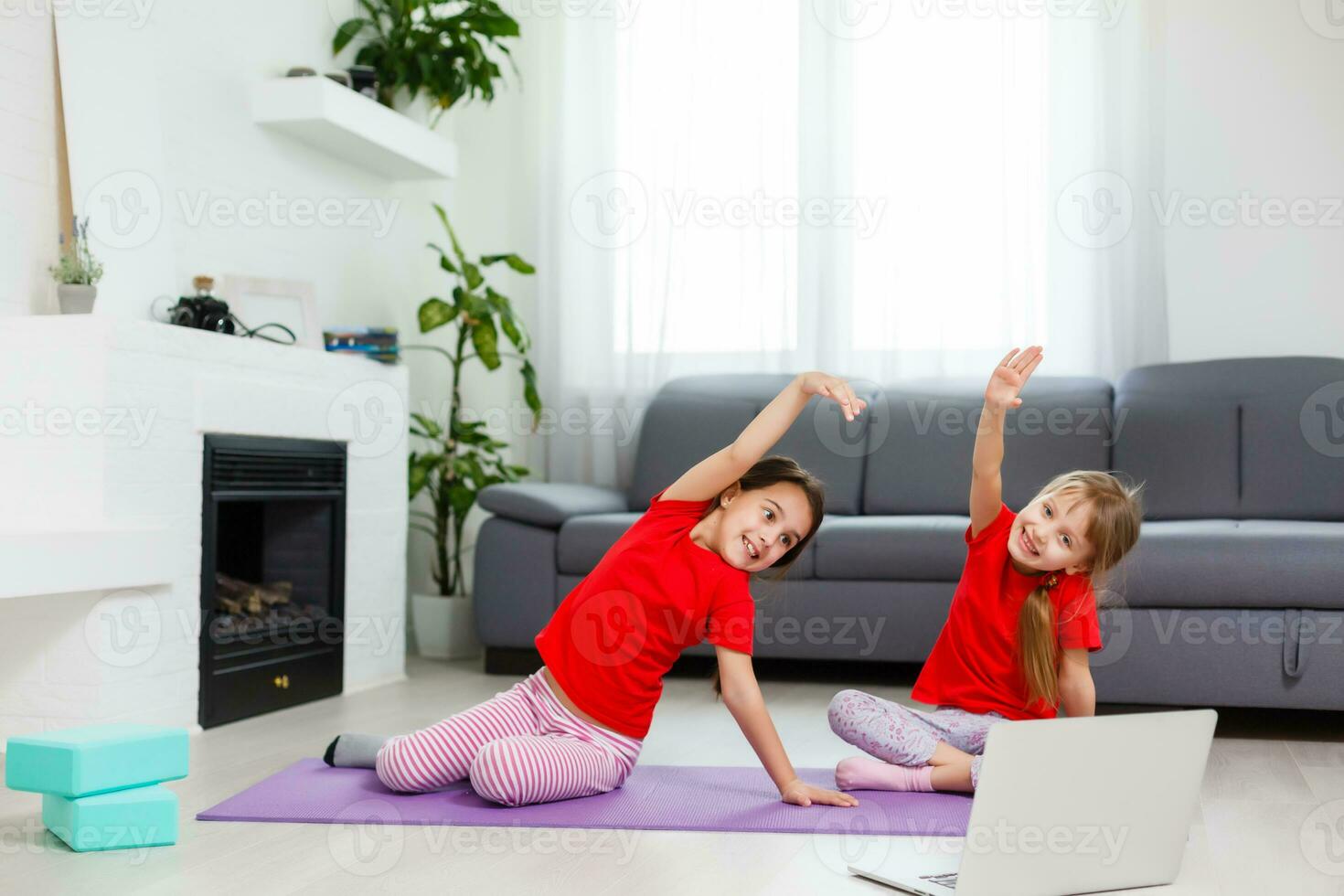 Full-length image little girls having fun at home sportive active kid girl. Funny leisure activities, sporty healthy lifestyle concept photo