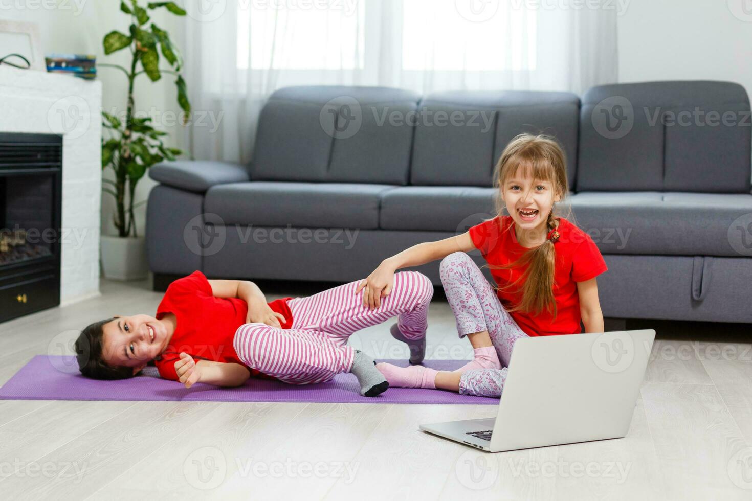 Full-length image little girls having fun at home sportive active kid girl. Funny leisure activities, sporty healthy lifestyle concept photo