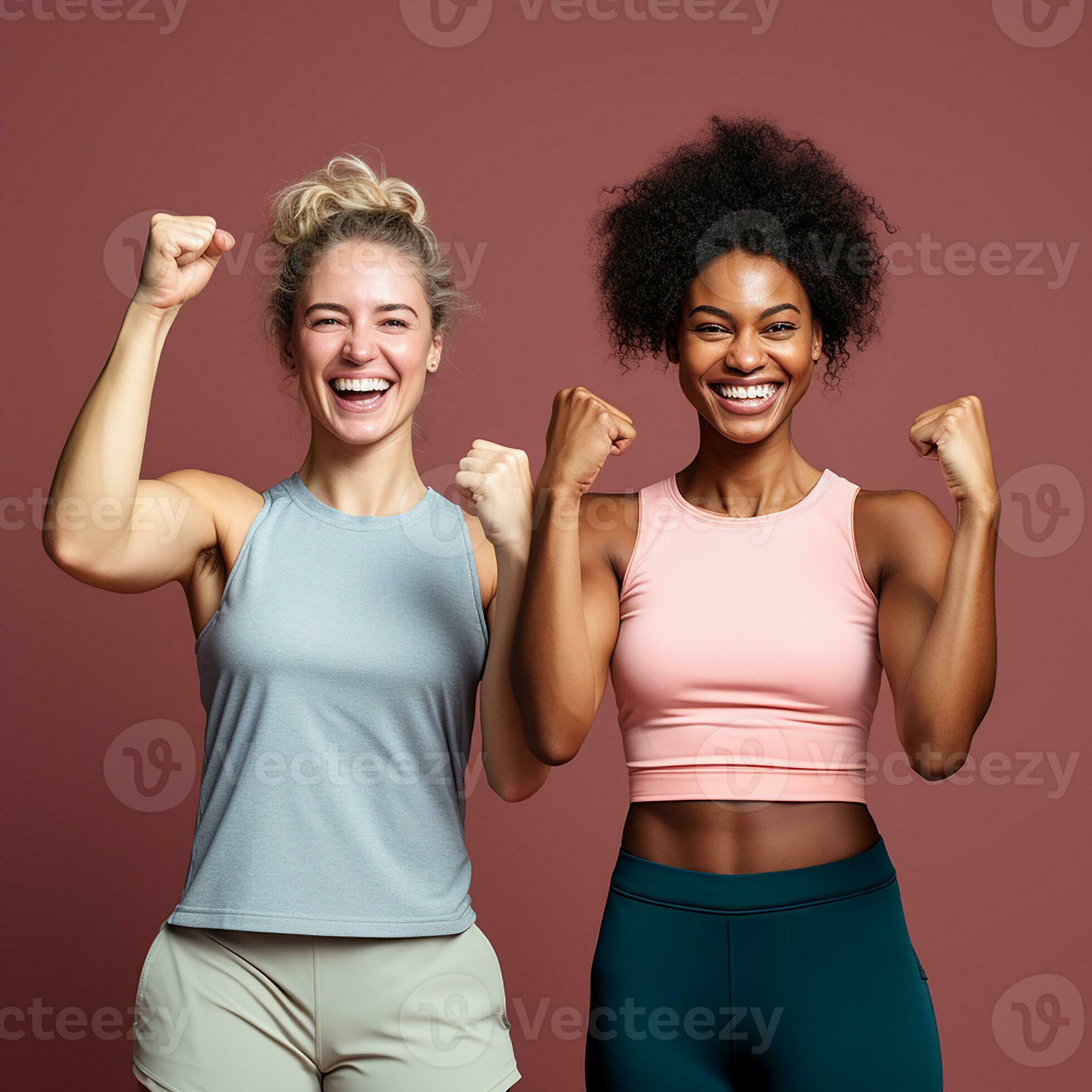 Two Sporty Women Jogging In A Park Wearing Sports Bras Stock Photo