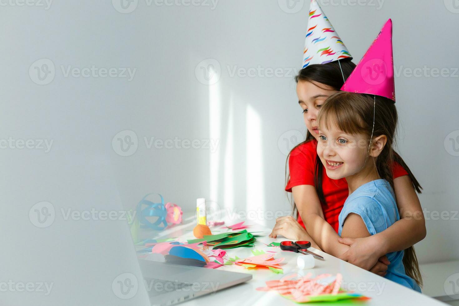 Kids online birthday party. Little girls in dresses, hat celebrate