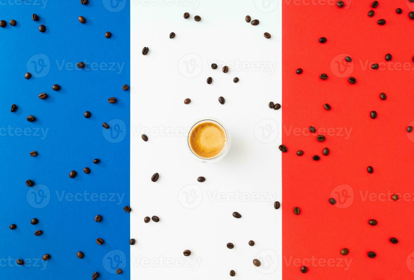 Creative layout made of cup of coffee and coffee beans on flag of France as a background. Minimal coffee concept. Trendy espresso idea. Unique flat lay composition. Coffee aesthetic. photo