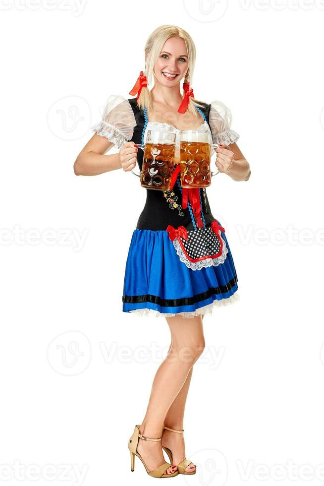 Full length portrait of a blond woman with traditional costume holding beer glasses isolated on white background. photo