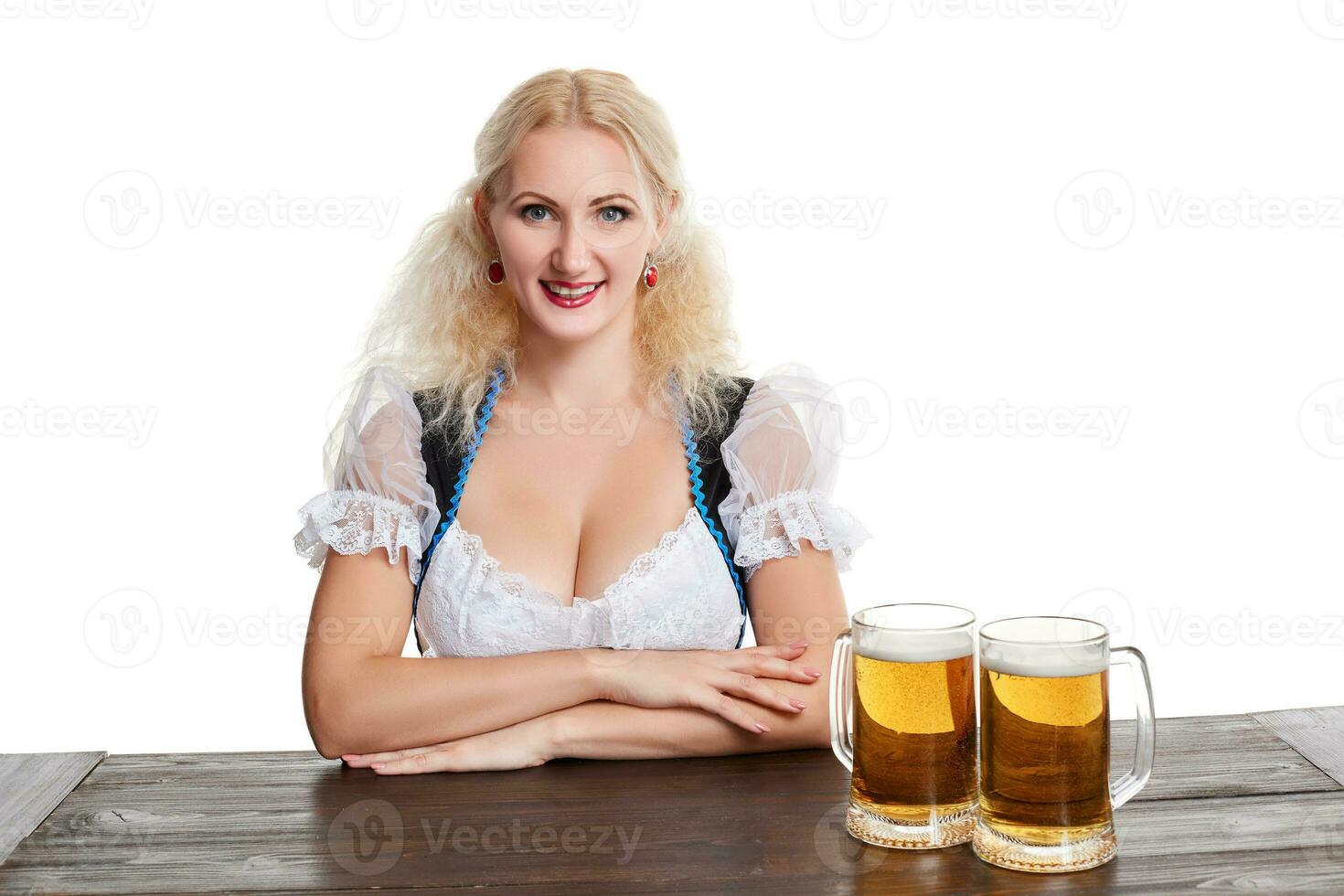 Beautiful young blond girl drinks out of oktoberfest beer stein photo