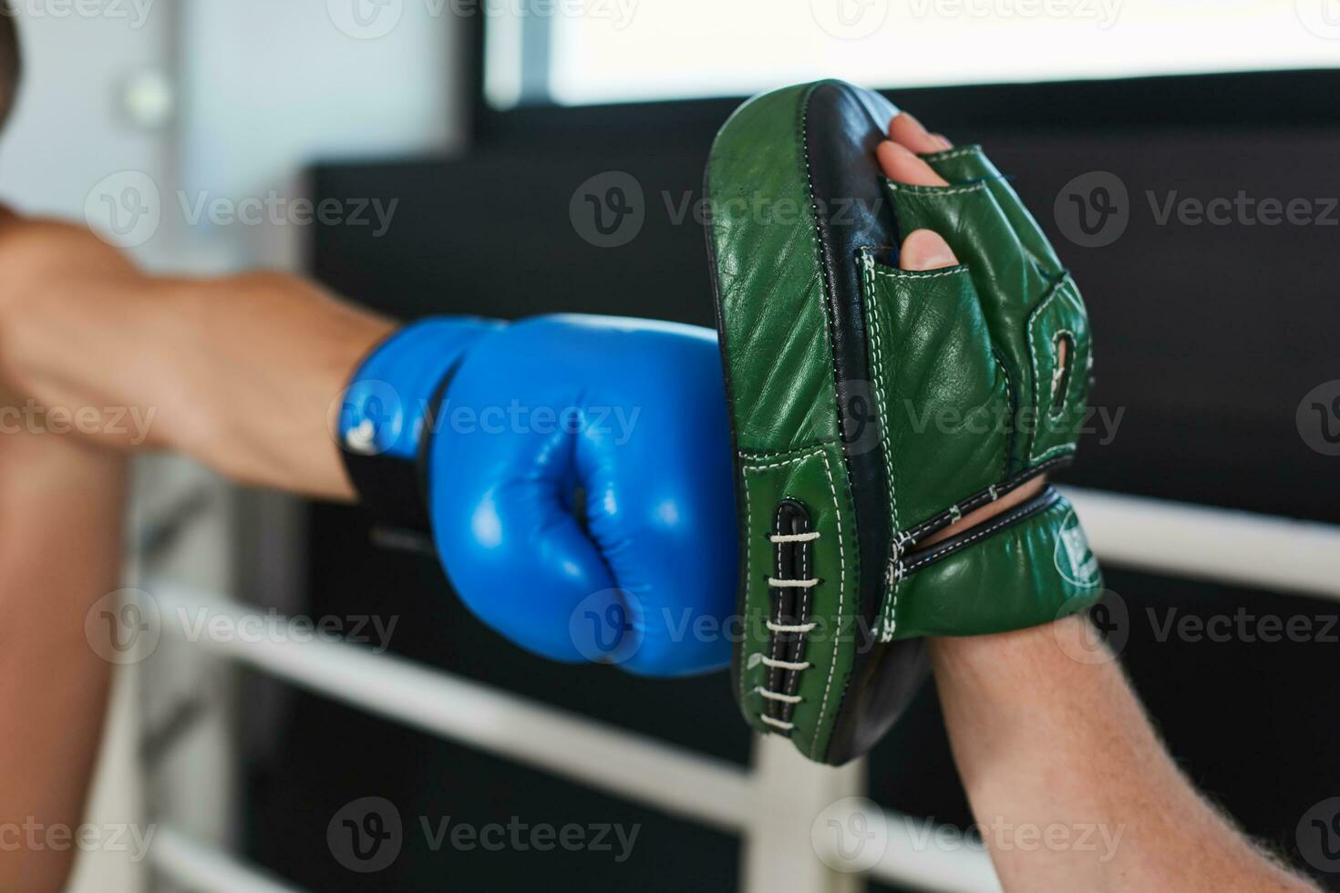 Hand of boxer and training gloves photo