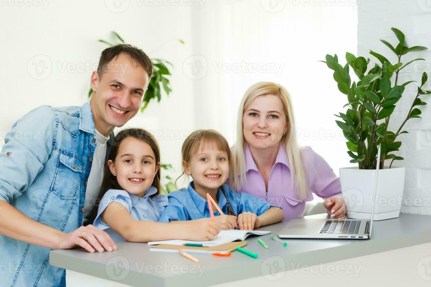 Family Working At Laptop With In Home Office photo