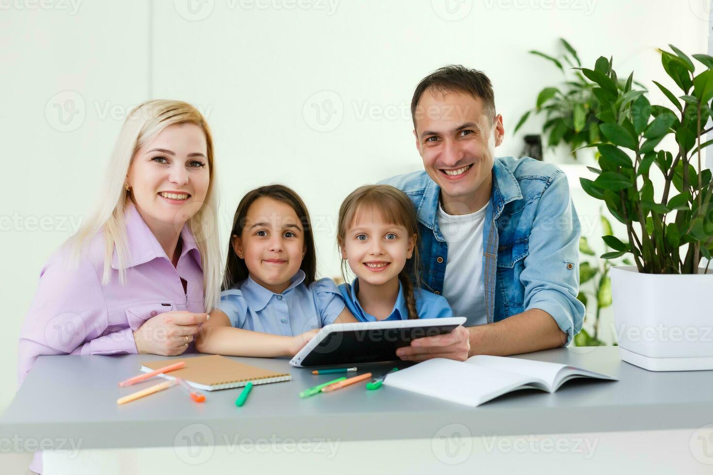 Family Working At Laptop With In Home Office photo