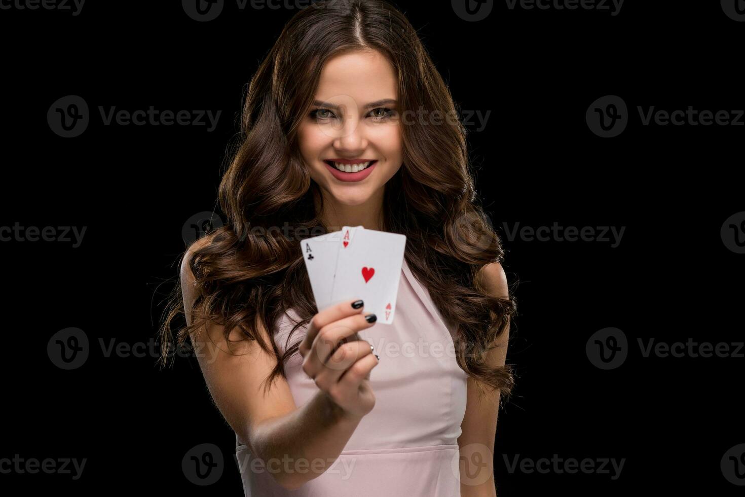 Attractive young woman holding the winning combination of poker cards photo