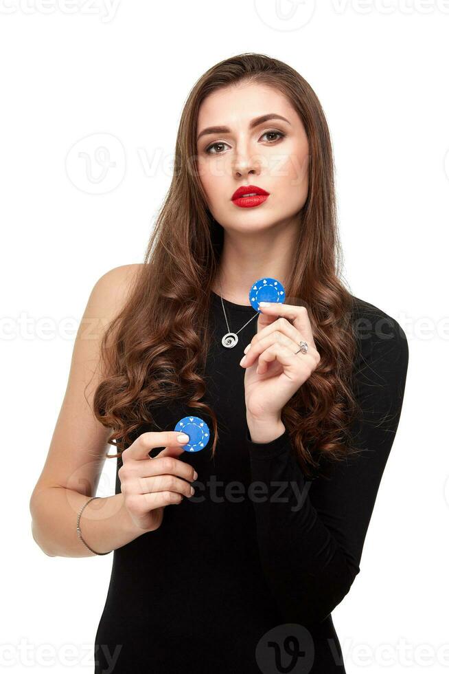 Sexy curly hair brunette posing with chips in her hands, poker concept isolation on white background photo