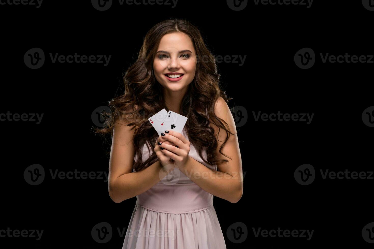 Attractive young woman holding the winning combination of poker cards photo