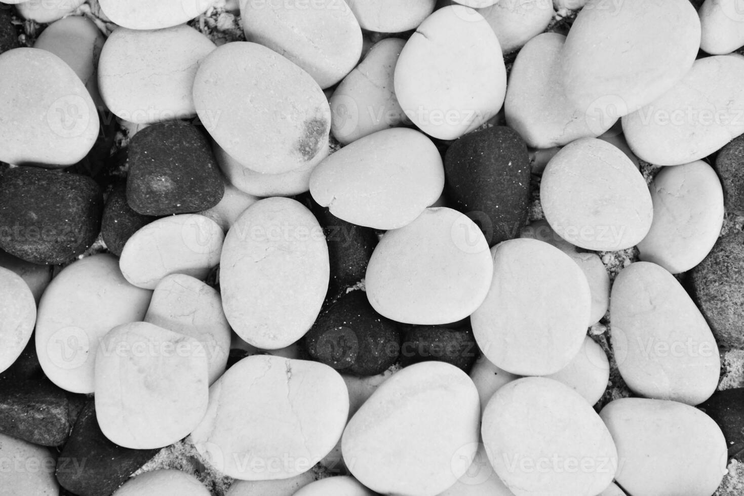 a black and white photo of pebbles