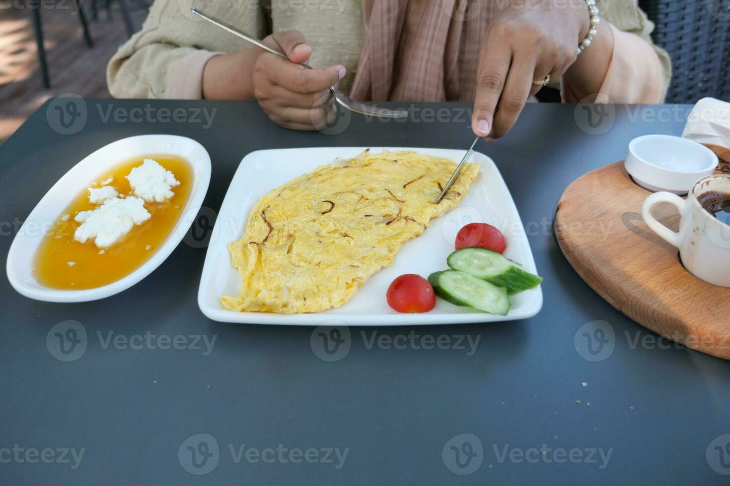 eating Plain Egg Omelette on table photo