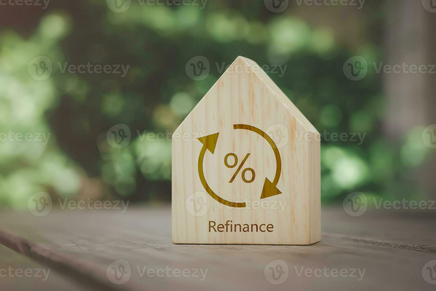 Percentage sign on wooden house with transfer or change symbol. Refinance to reduce the interest of home loan. Mortgage, loan, repayments, credit limit, interest rate, business and financial concept. photo