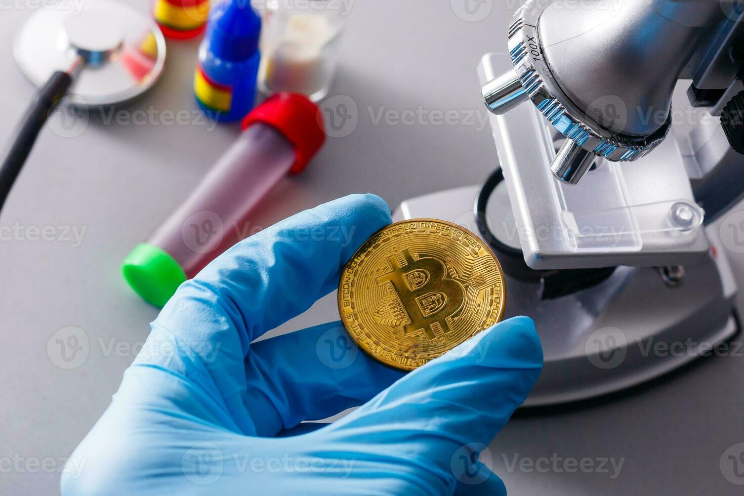Coin crypto currency bitcoin lies on the microscope background theme of the gold exchange pyramid for money due to the rise or fall of the exchange rate. photo