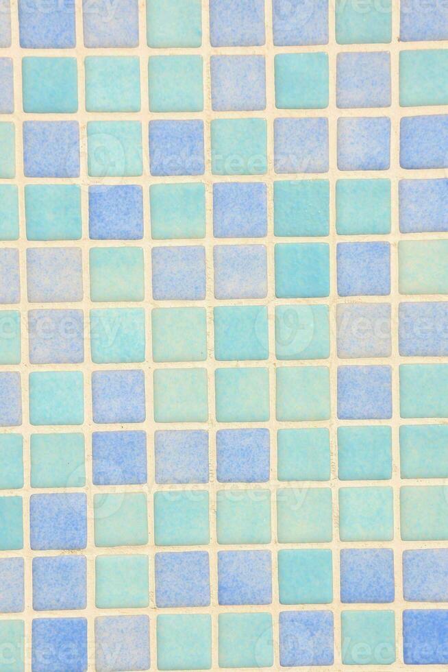 a blue and white tile wall with squares photo