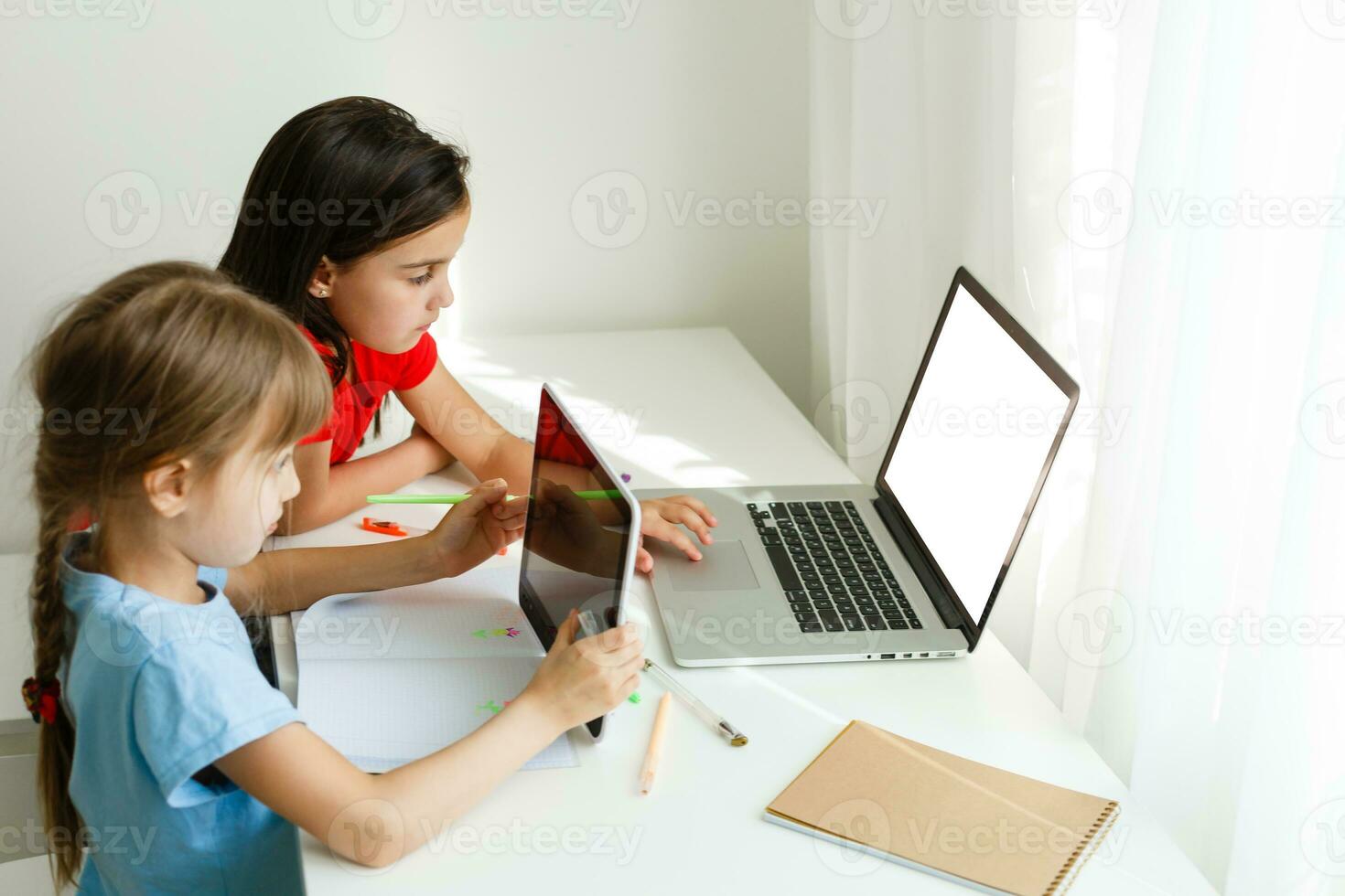 Learning from home, Home school kid concept. Little children study online learning from home with laptop. Quarantine and Social distancing concept. photo
