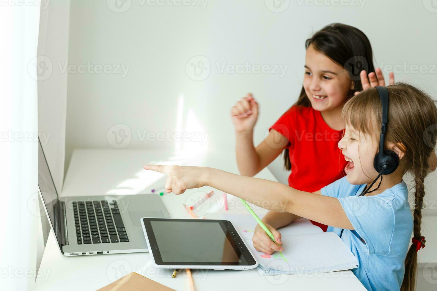 Learning from home, Home school kid concept. Little children study online learning from home with laptop. Quarantine and Social distancing concept. photo