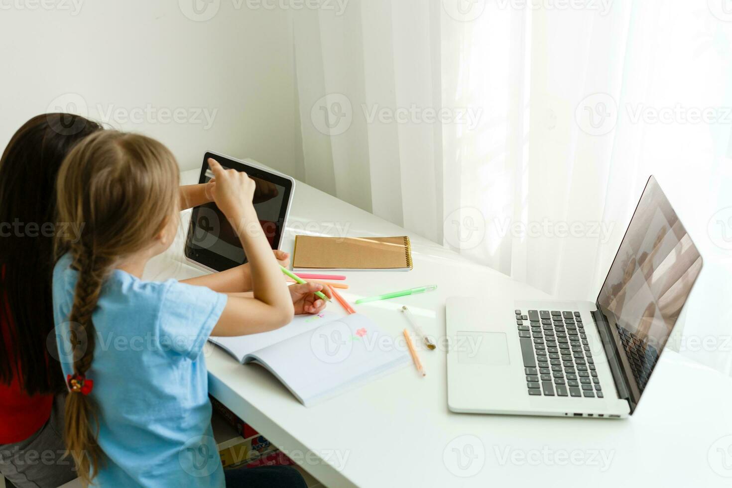 Learning from home, Home school kid concept. Little children study online learning from home with laptop. Quarantine and Social distancing concept. photo