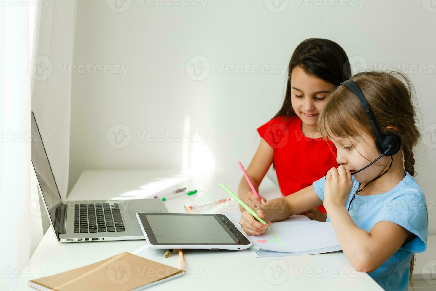 Learning from home, Home school kid concept. Little children study online learning from home with laptop. Quarantine and Social distancing concept. photo