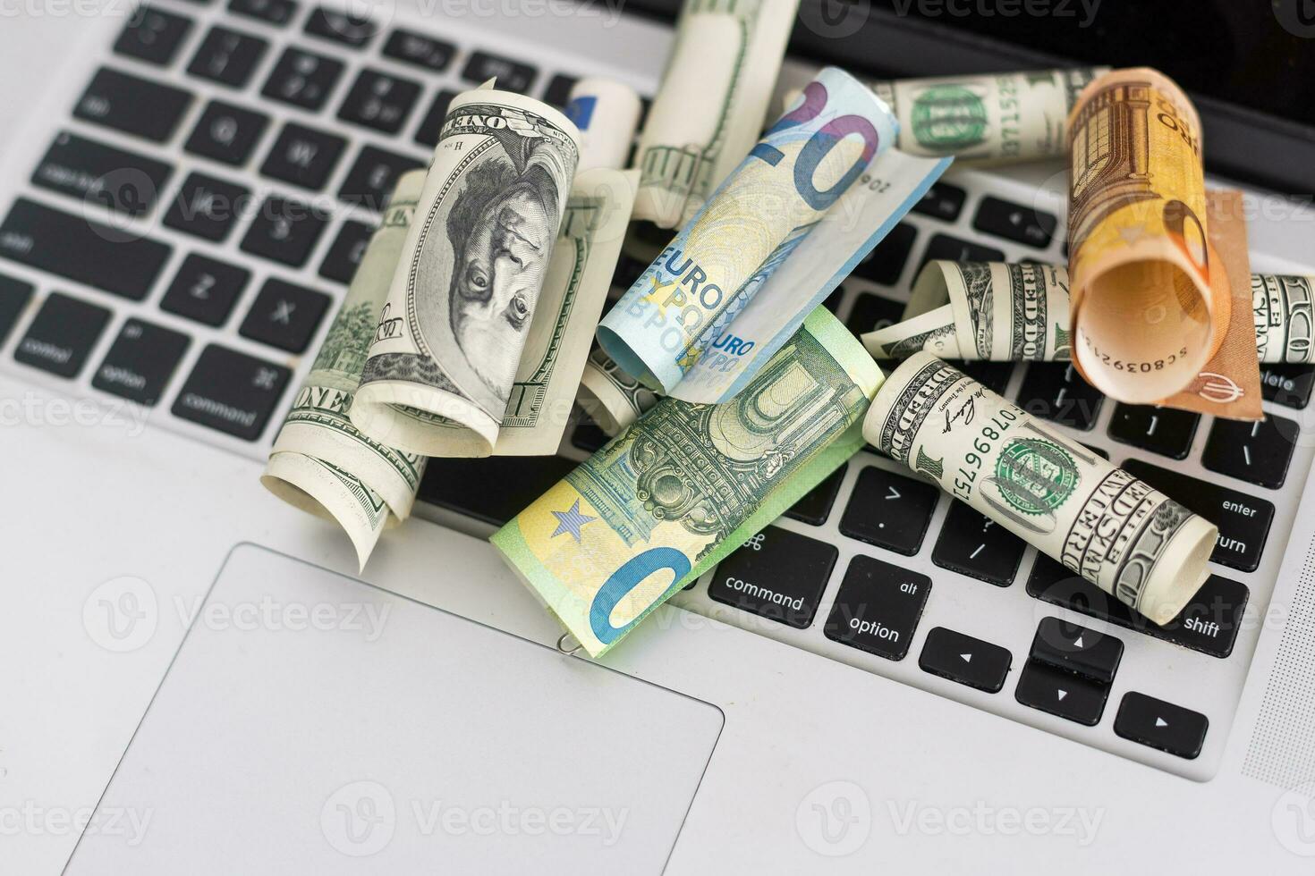 US dollars in closeup on laptop. photo