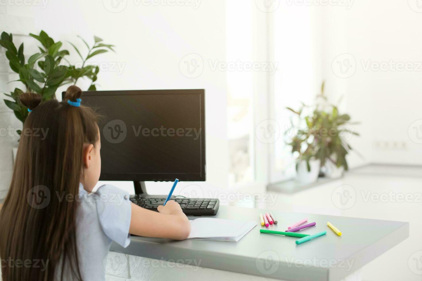 Little Girl Using Computer Concept, distance online learning photo