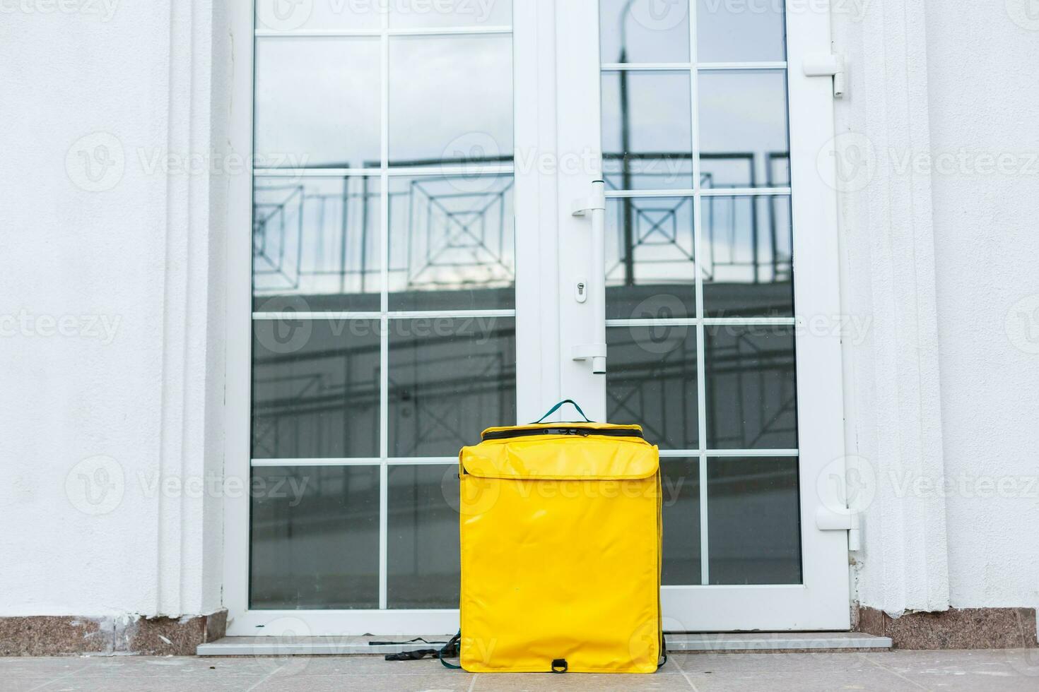 thermo bag near the entrance home. Food delivery service photo