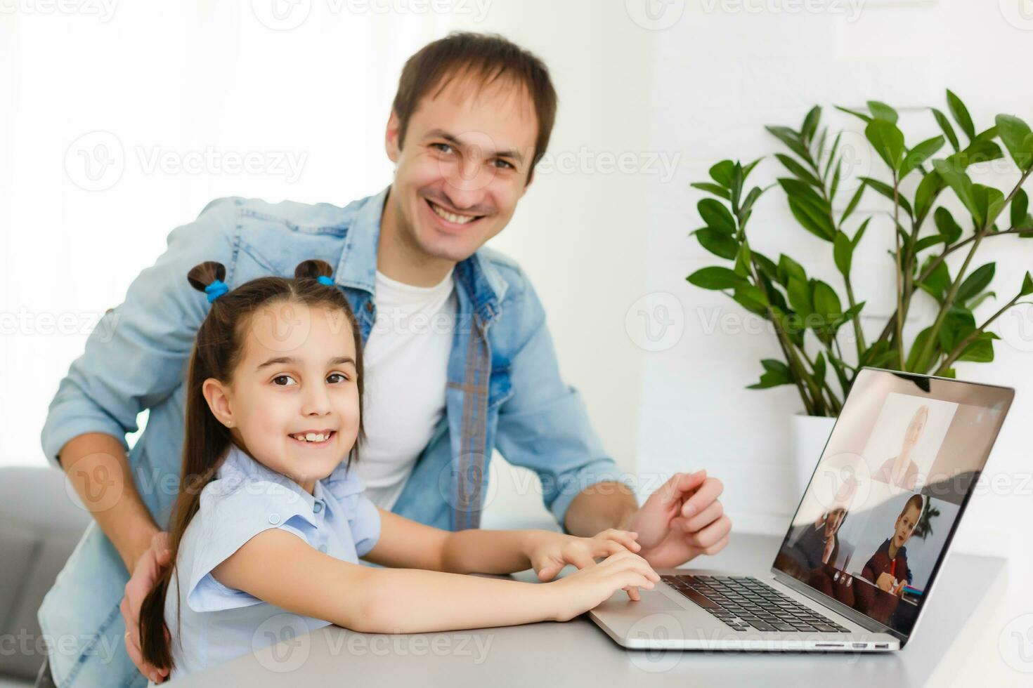 Digital composite of People using a computer with E-Learning information in the screen photo