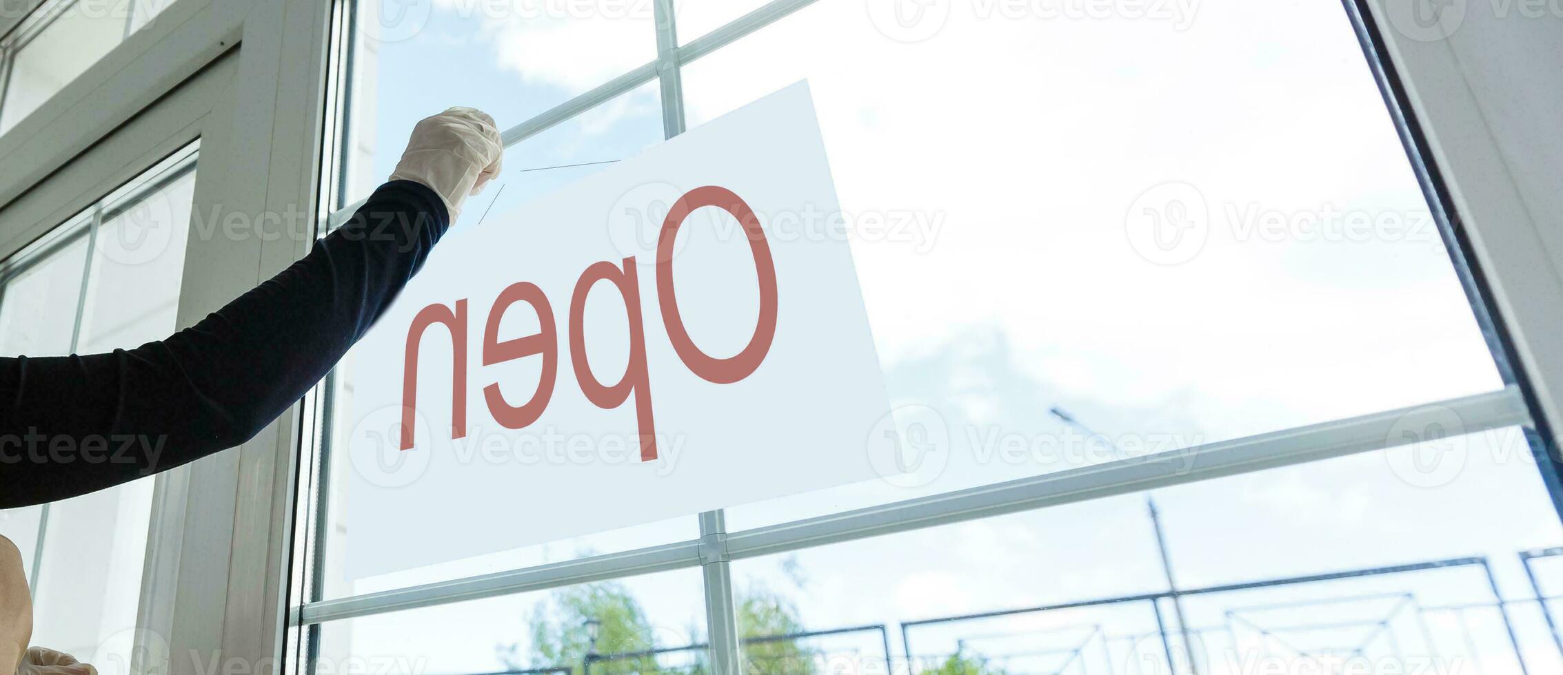 small business owner asian woman smiling and standing with crossed arms in cafe bar. beautiful waitress in entrance of coffee shop showing open sign door plate welcome face camera confident looking photo