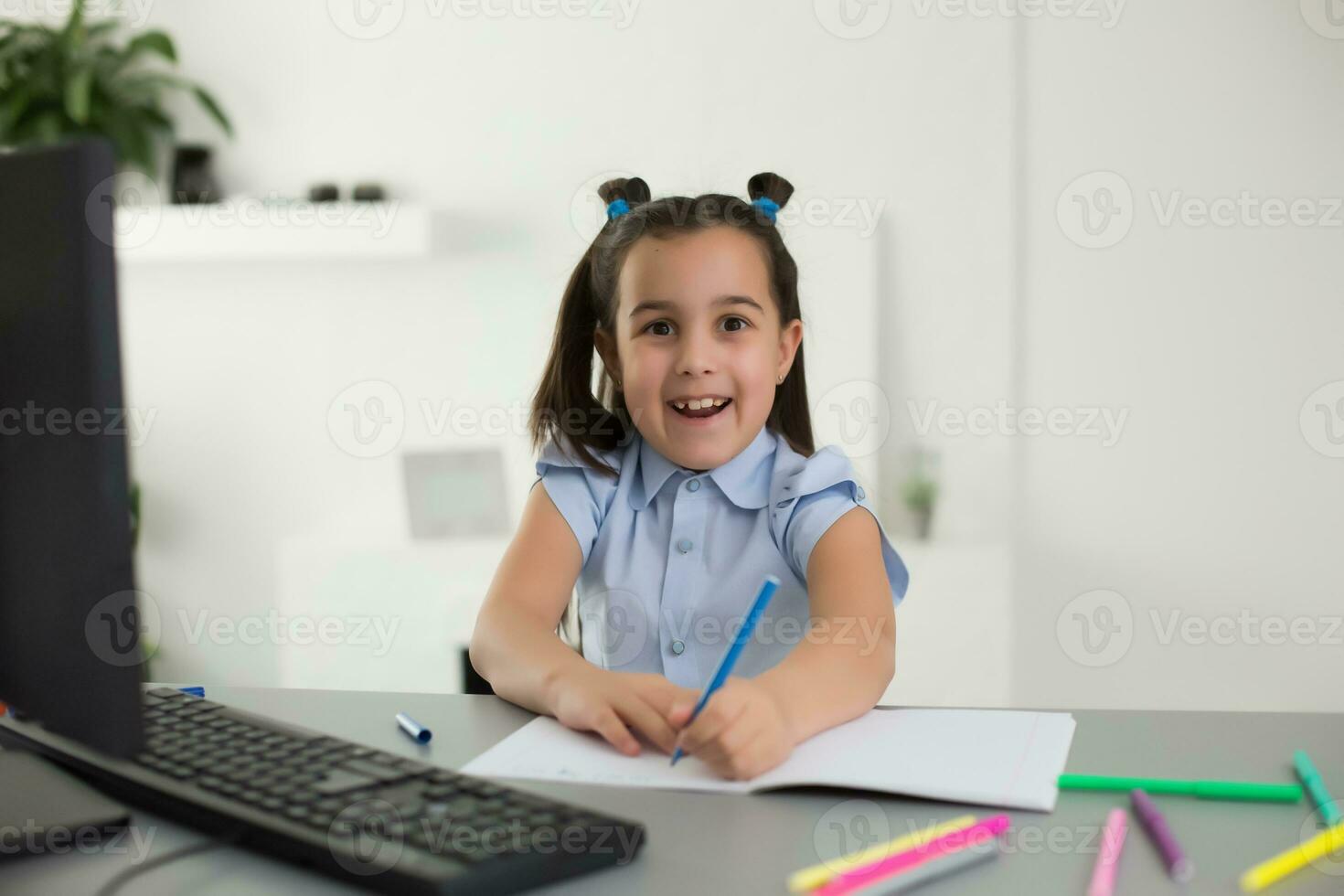 Pretty stylish schoolgirl studying homework math during her online lesson at home, social distance during quarantine, self-isolation, online education concept, home schooler photo