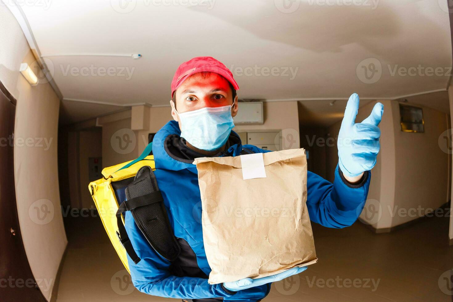 delivery man send food bag at door knob for contactless or contact free from delivery rider in front house for social distancing for infection risk. photo