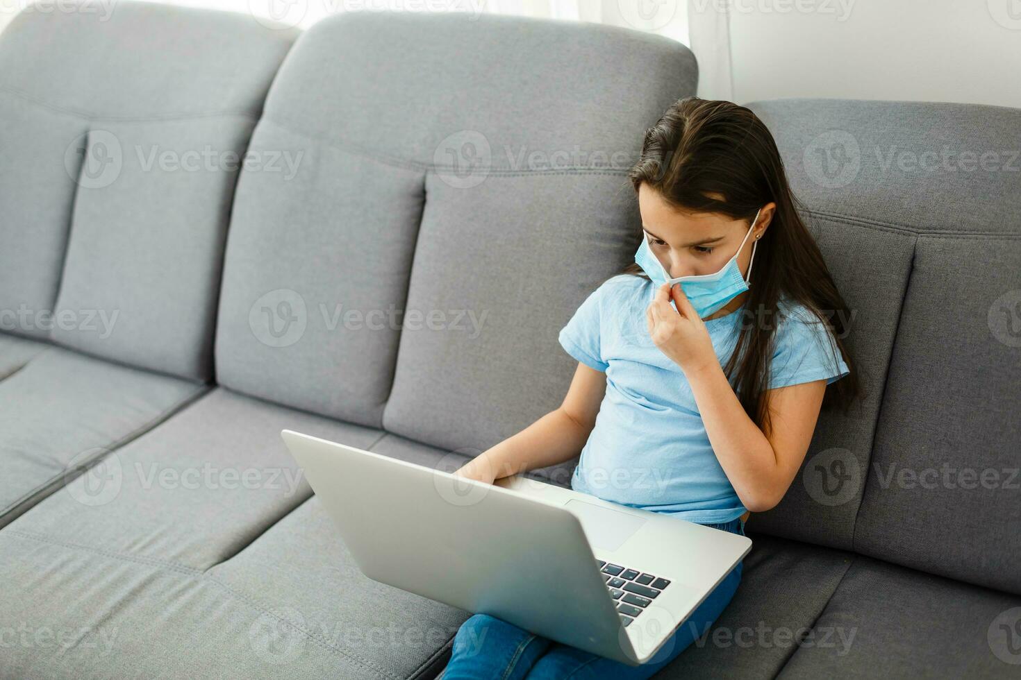 Little Girl Using Digital Laptop E-learning Concept. little girl children using laptop computer, studying through online e-learning system. photo
