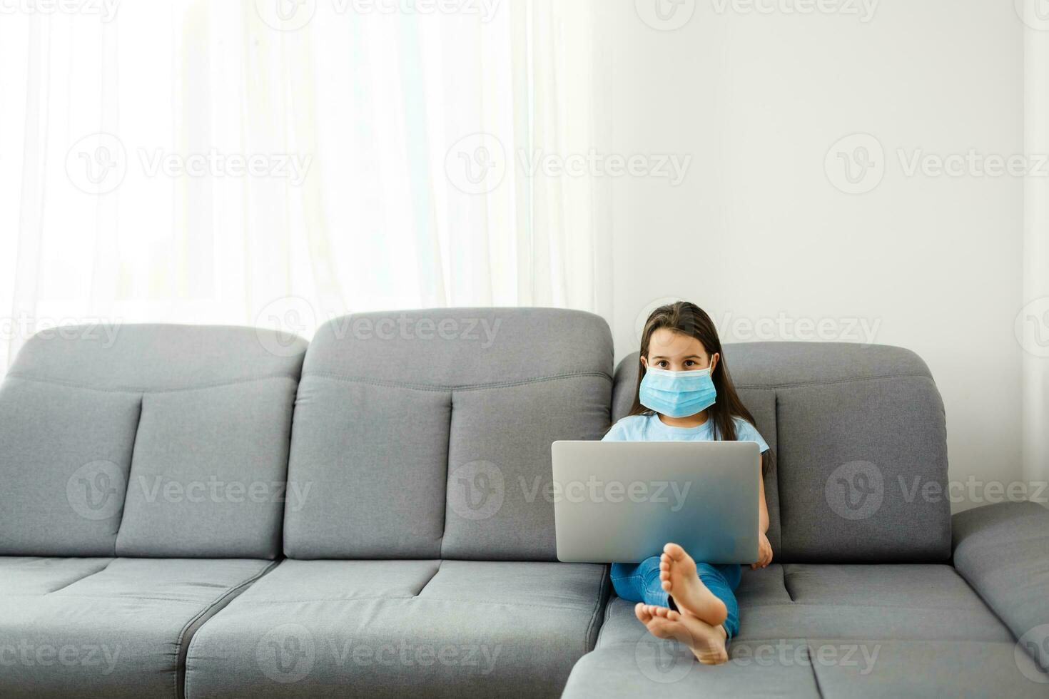 Little Girl Using Digital Laptop E-learning Concept. little girl children using laptop computer, studying through online e-learning system. photo