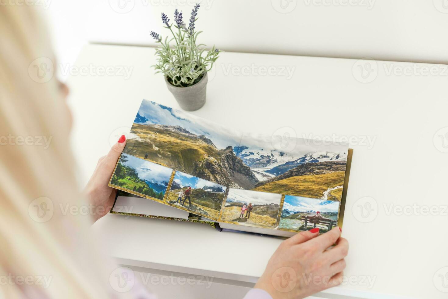 Close-up Of Couple Looking At Photo Album