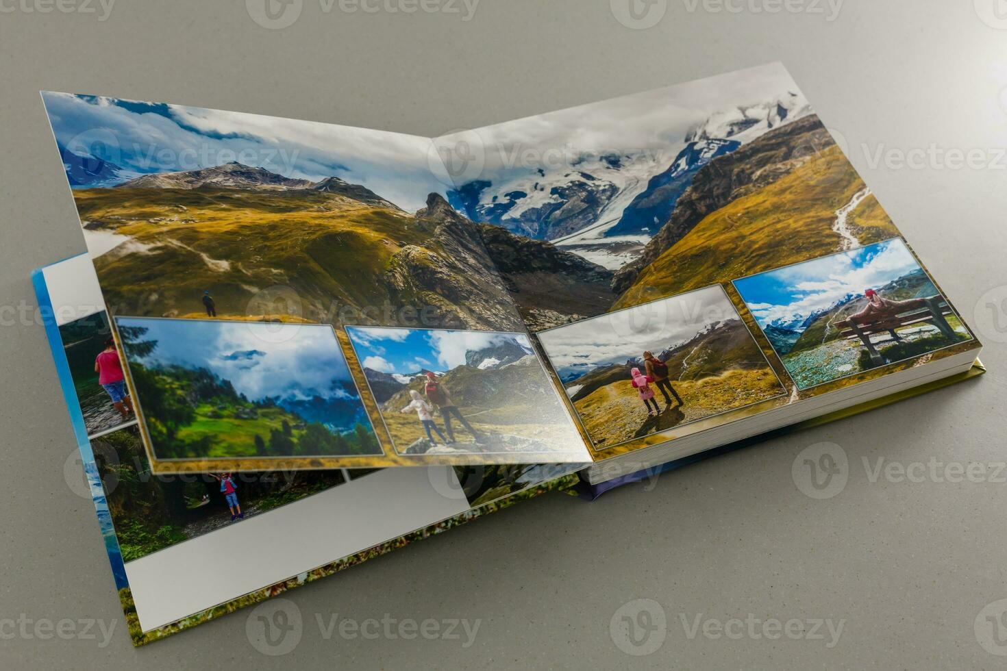 open photo book on a gray background