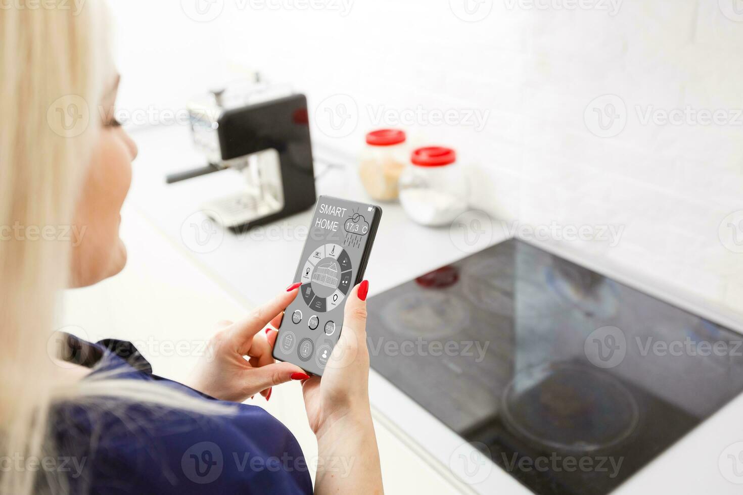Smart Home Device-Home Management. Woman presses the virtual button photo