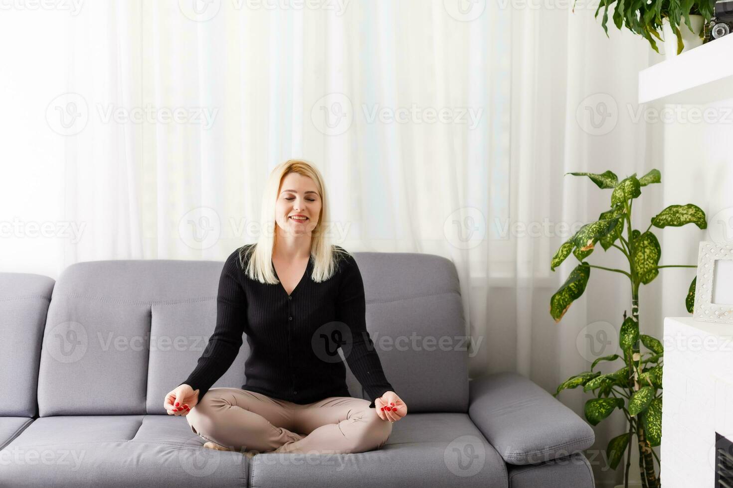 Relaxed young woman lying on couch photo