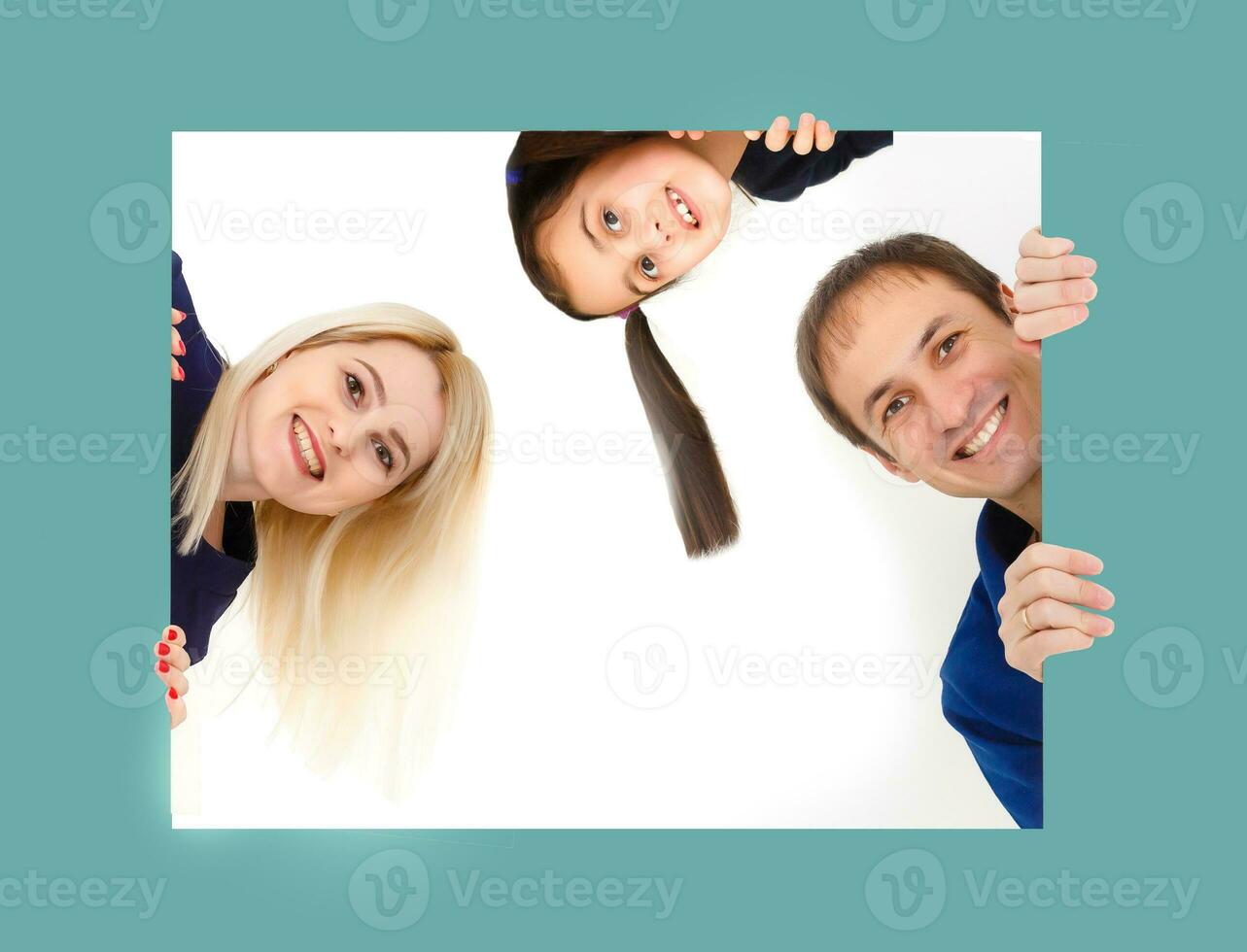 family holds holds photo canvas at home