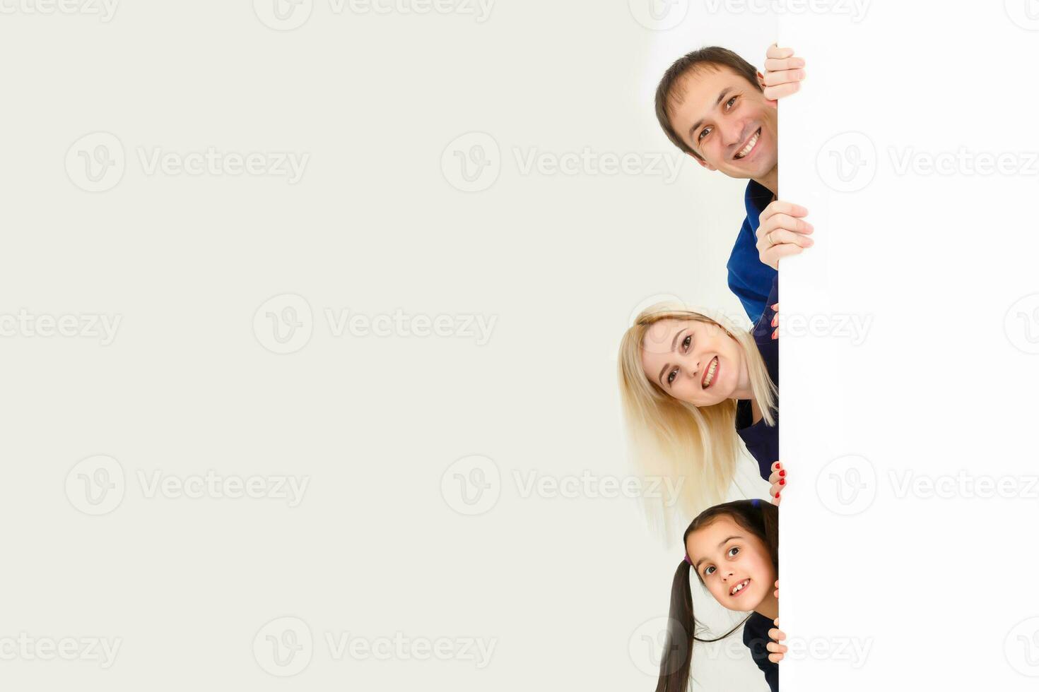 family holds holds photo canvas at home