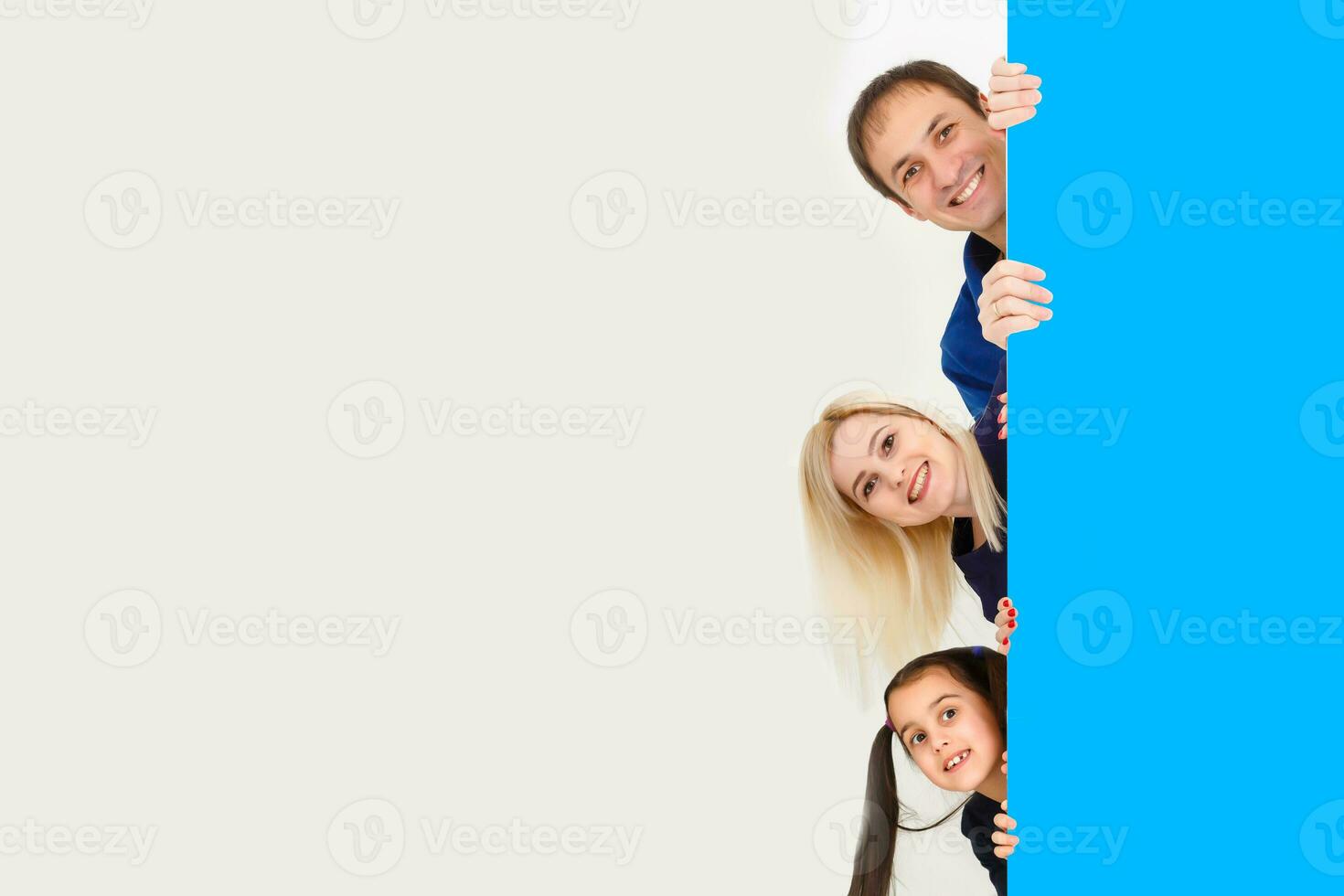 family holds holds photo canvas at home