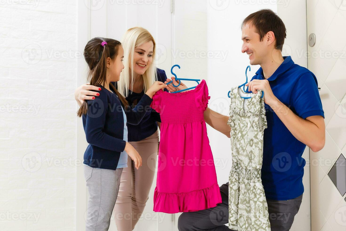 Little girl trying on a new clothes photo