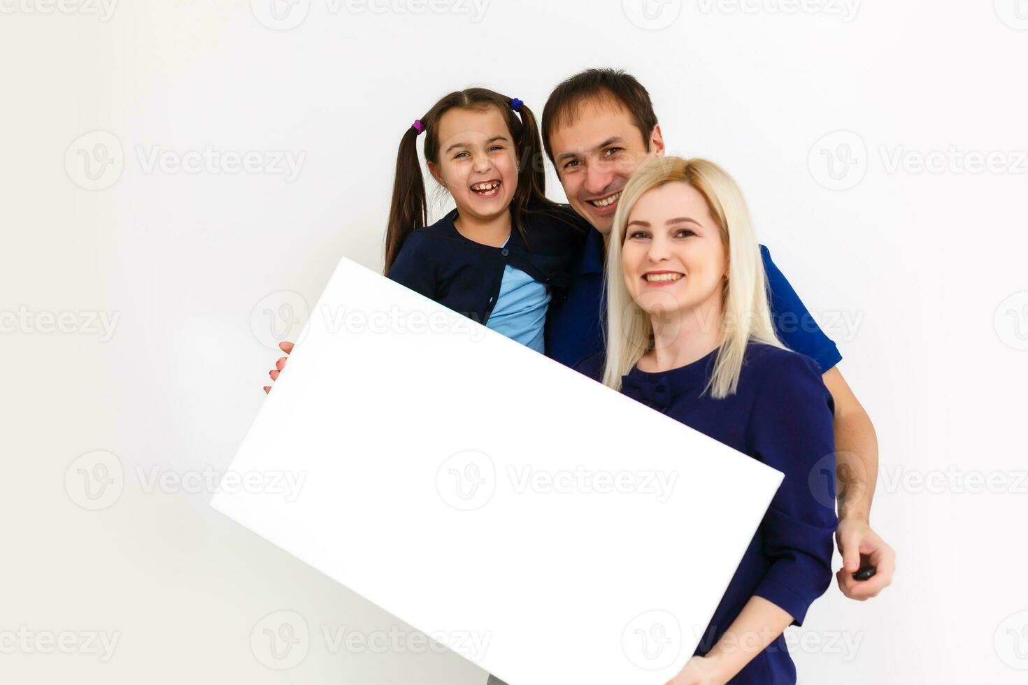 family holds holds photo canvas at home