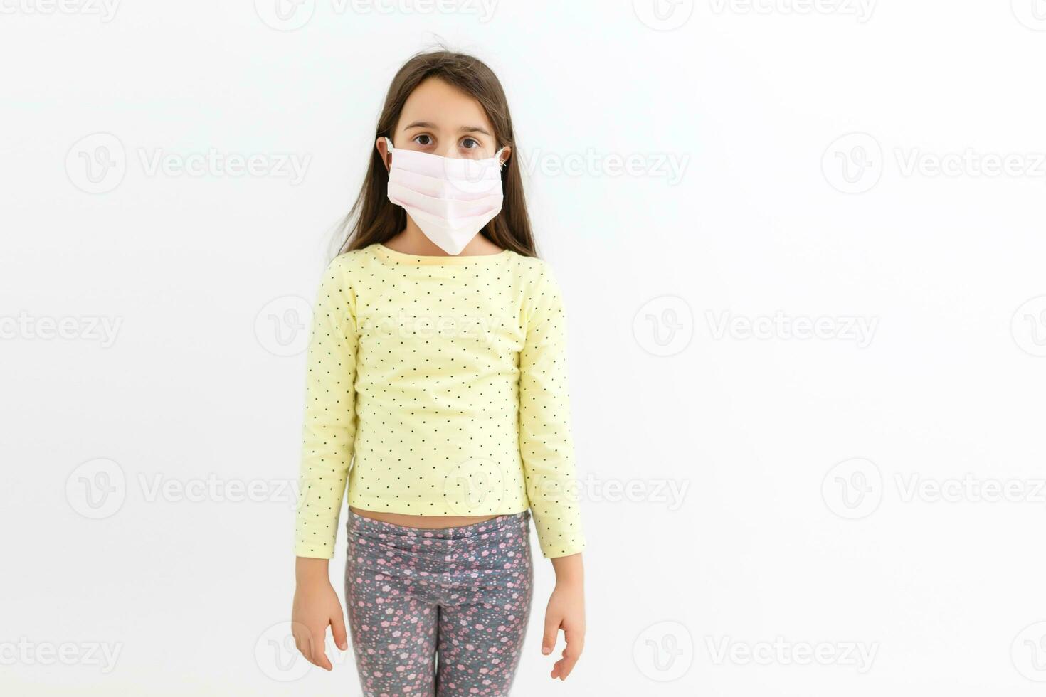 little girl wear mask on white background, A girl wearing protection medical mask covid-19 or coronavirus from Infected person, corona protected Help protect For world and people stop virus warning photo