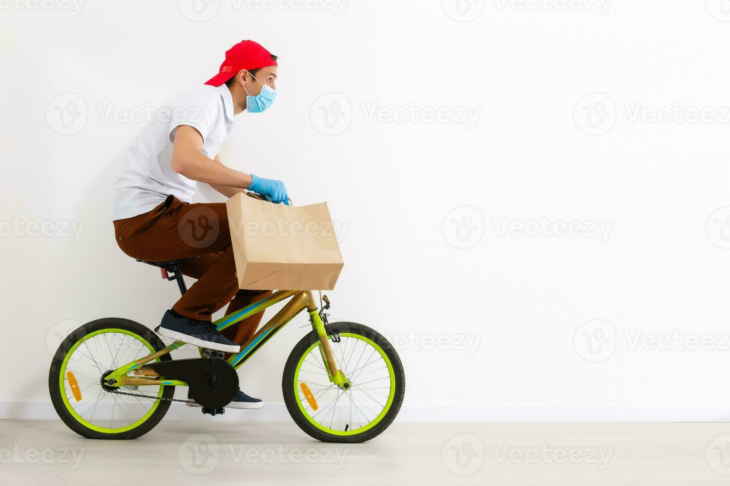 The courier delivers a box of food while the coronavirus pandemic, horizontal orientation photo