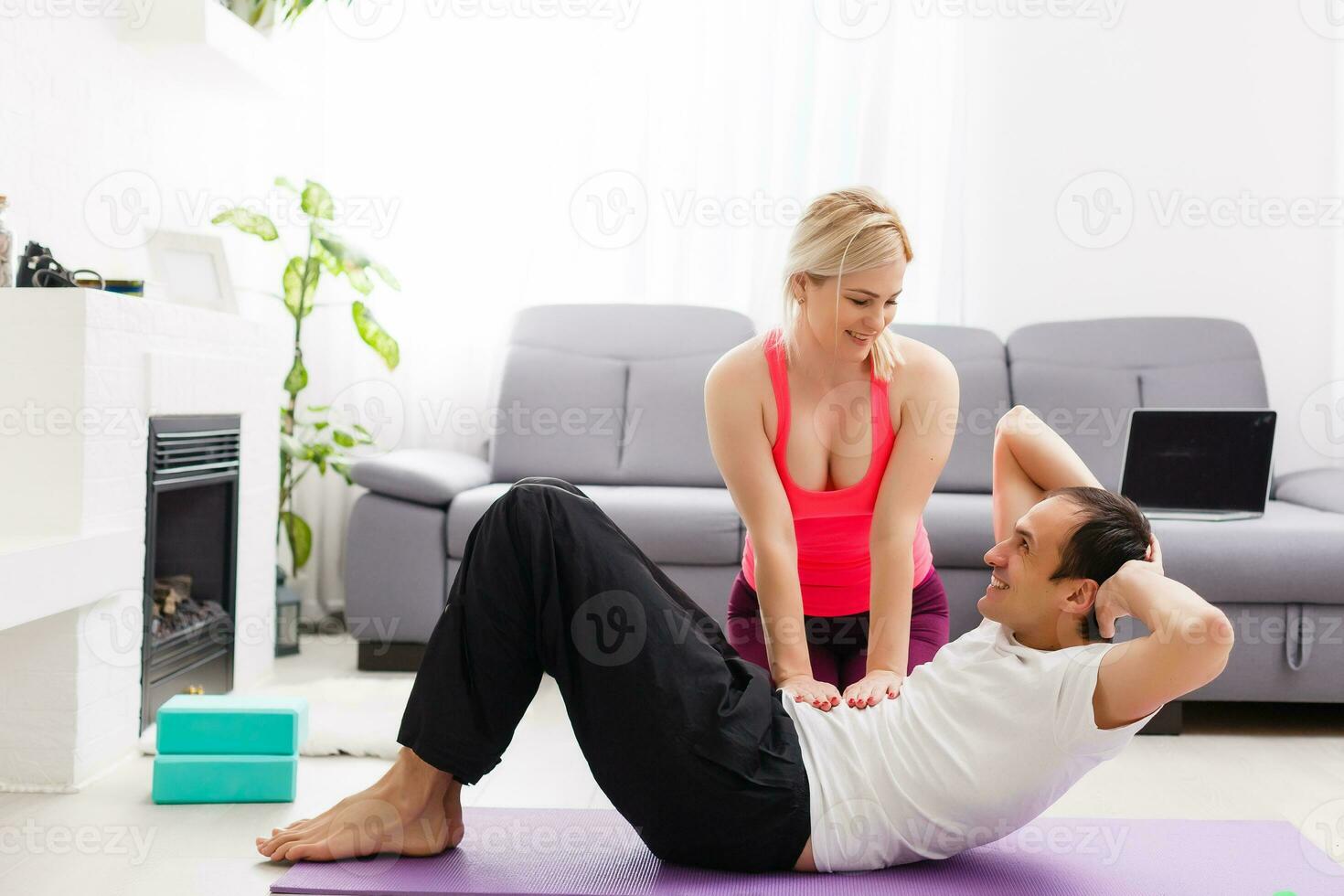 couple doing exercises at home. Yoga concept. photo