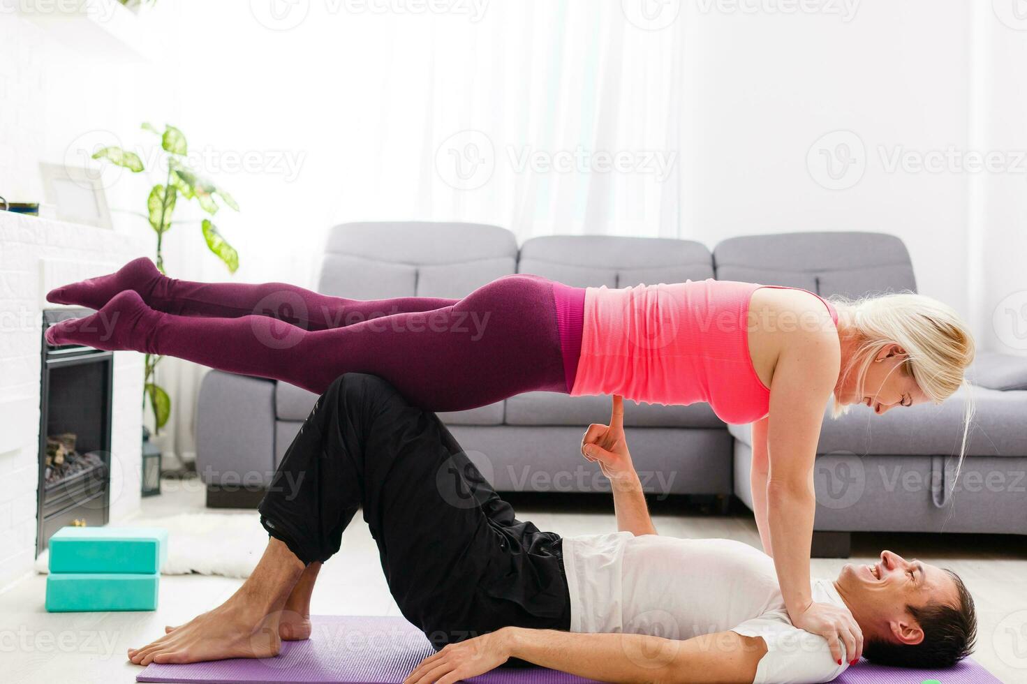 couple doing exercises at home. Yoga concept. photo