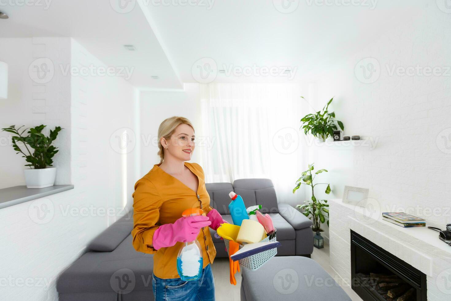 Smiling worth girl with the equipment for cleaning photo