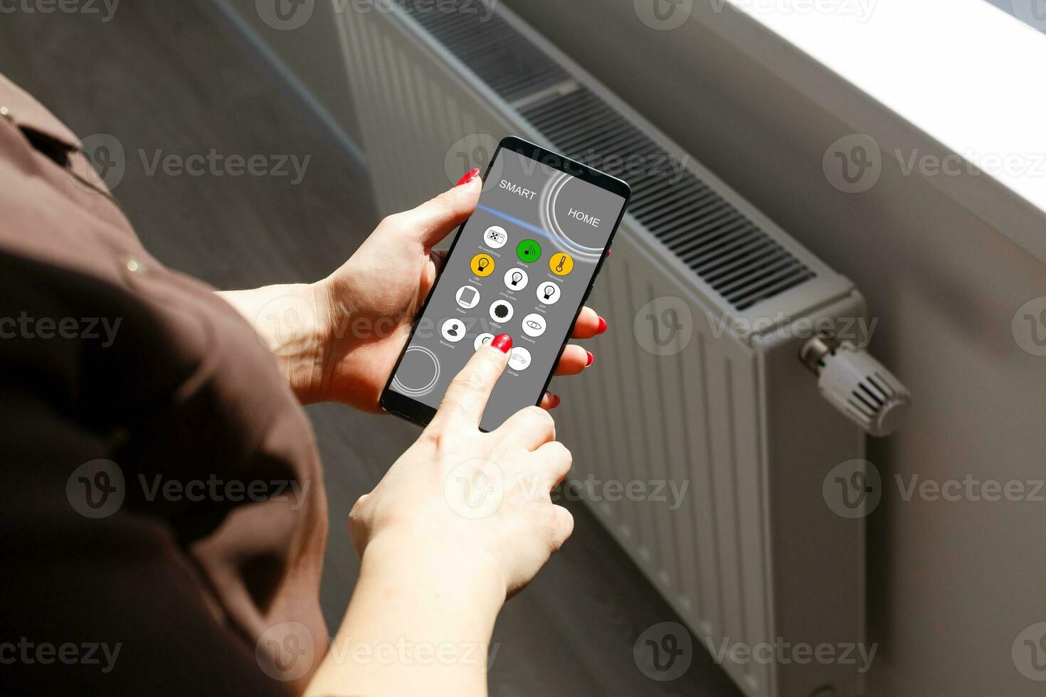 Smart home, intelligent house automation remote control technology concept on smart phone photo