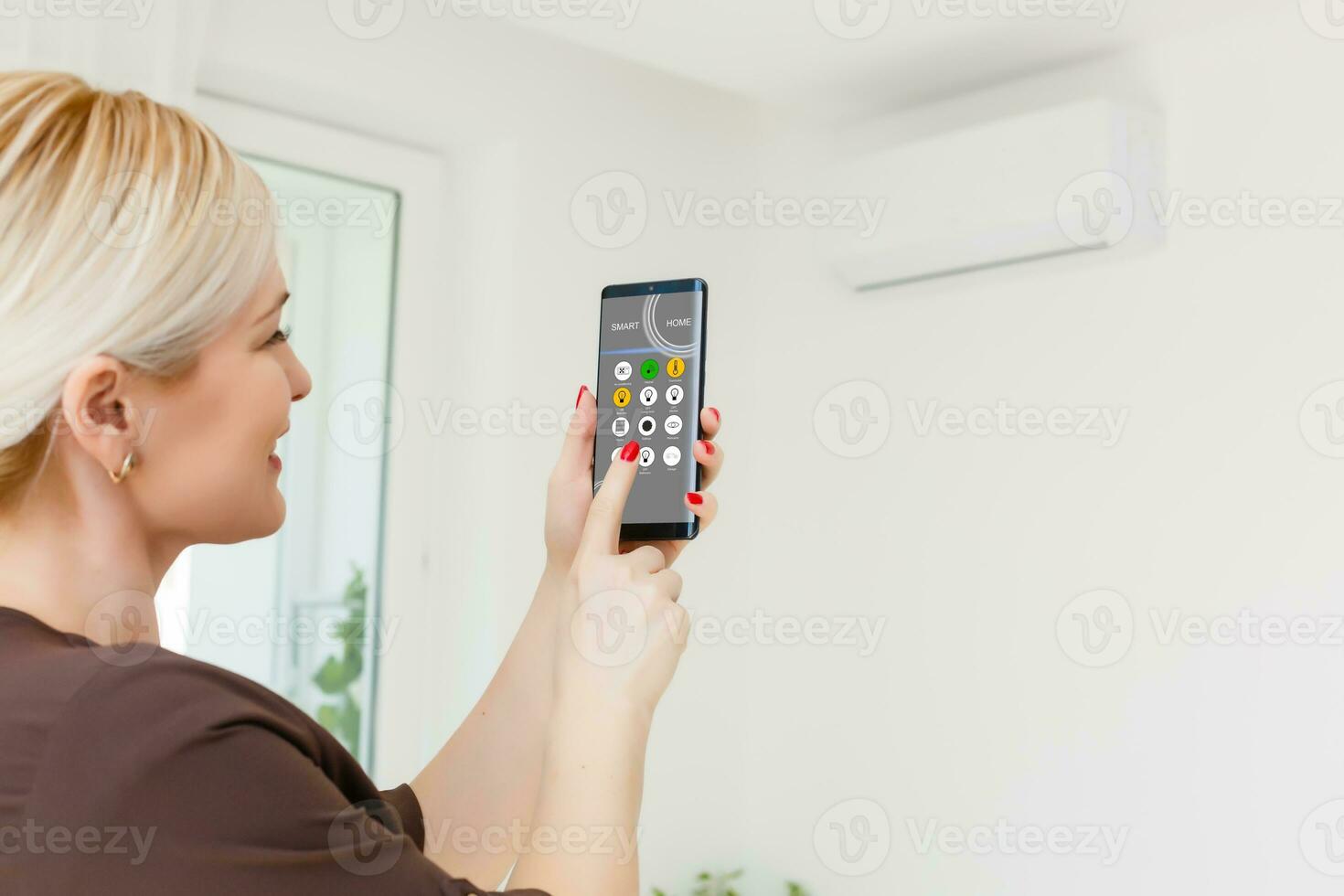 Smart home, intelligent house automation remote control technology concept on smart phone photo